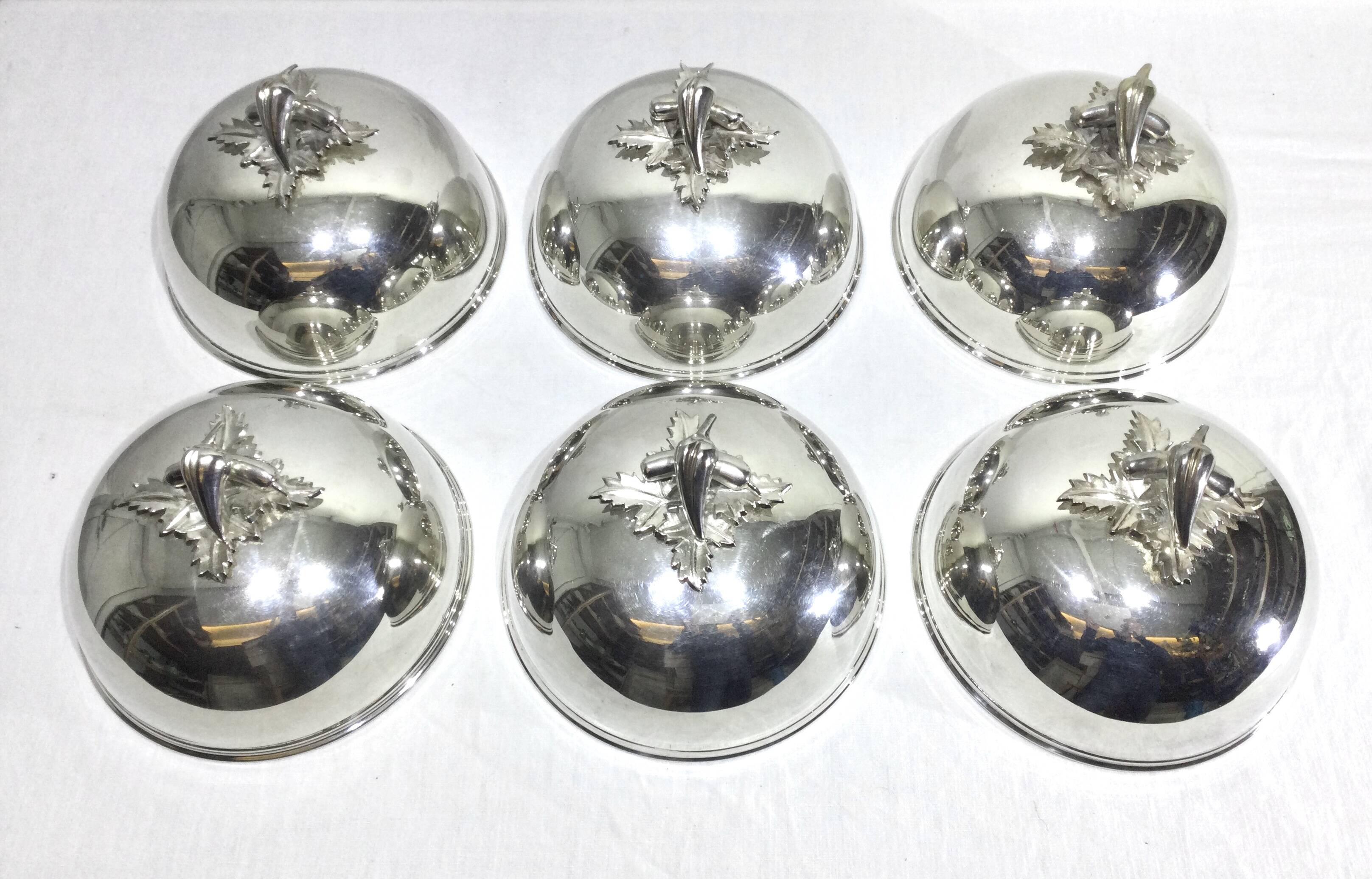 Set of silver-plated serving dishes and bells
