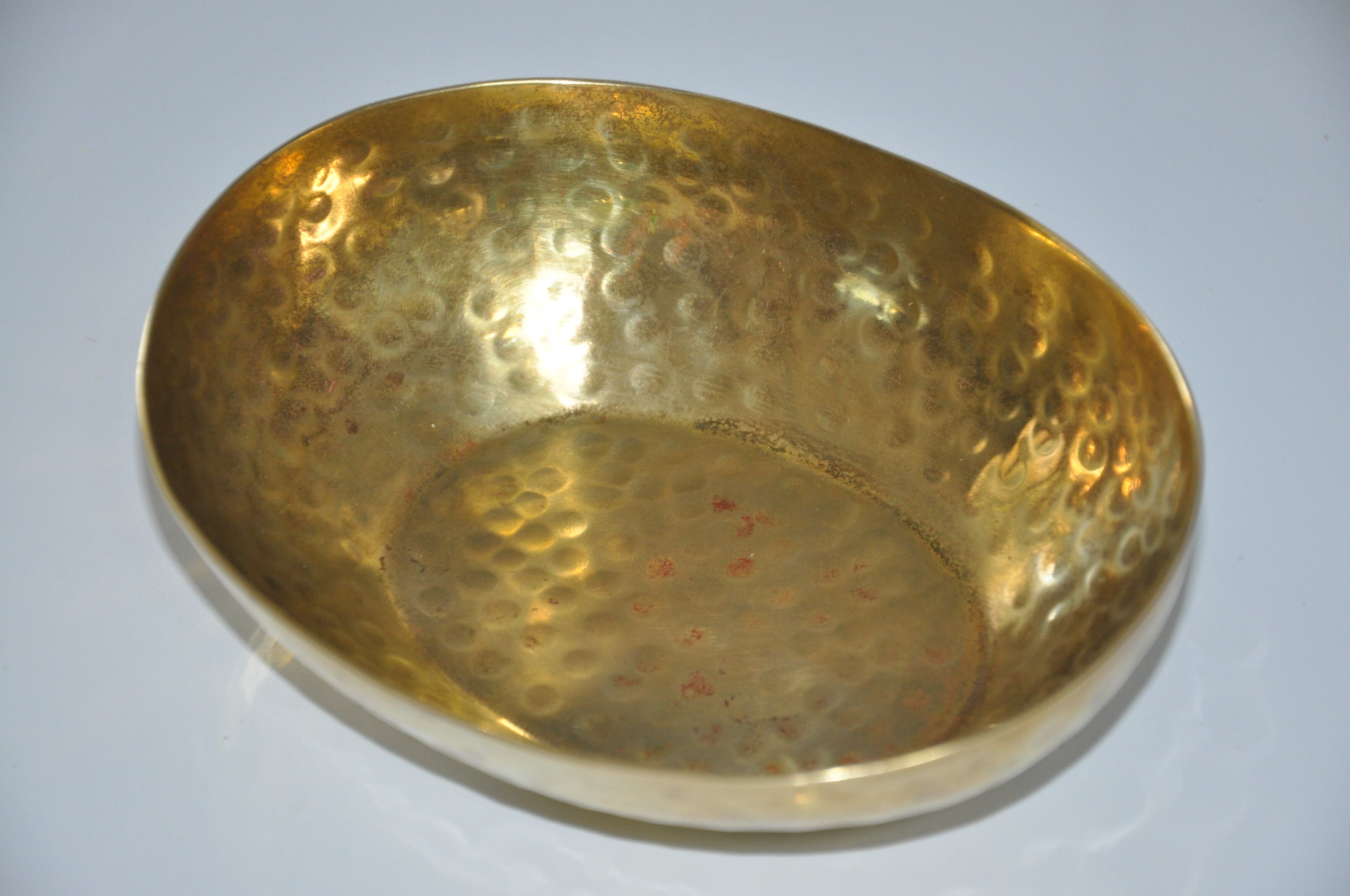 Empty hammered brass pocket