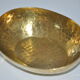 Empty hammered brass pocket