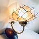 Vintage mother-of-pearl and brass flower wall light