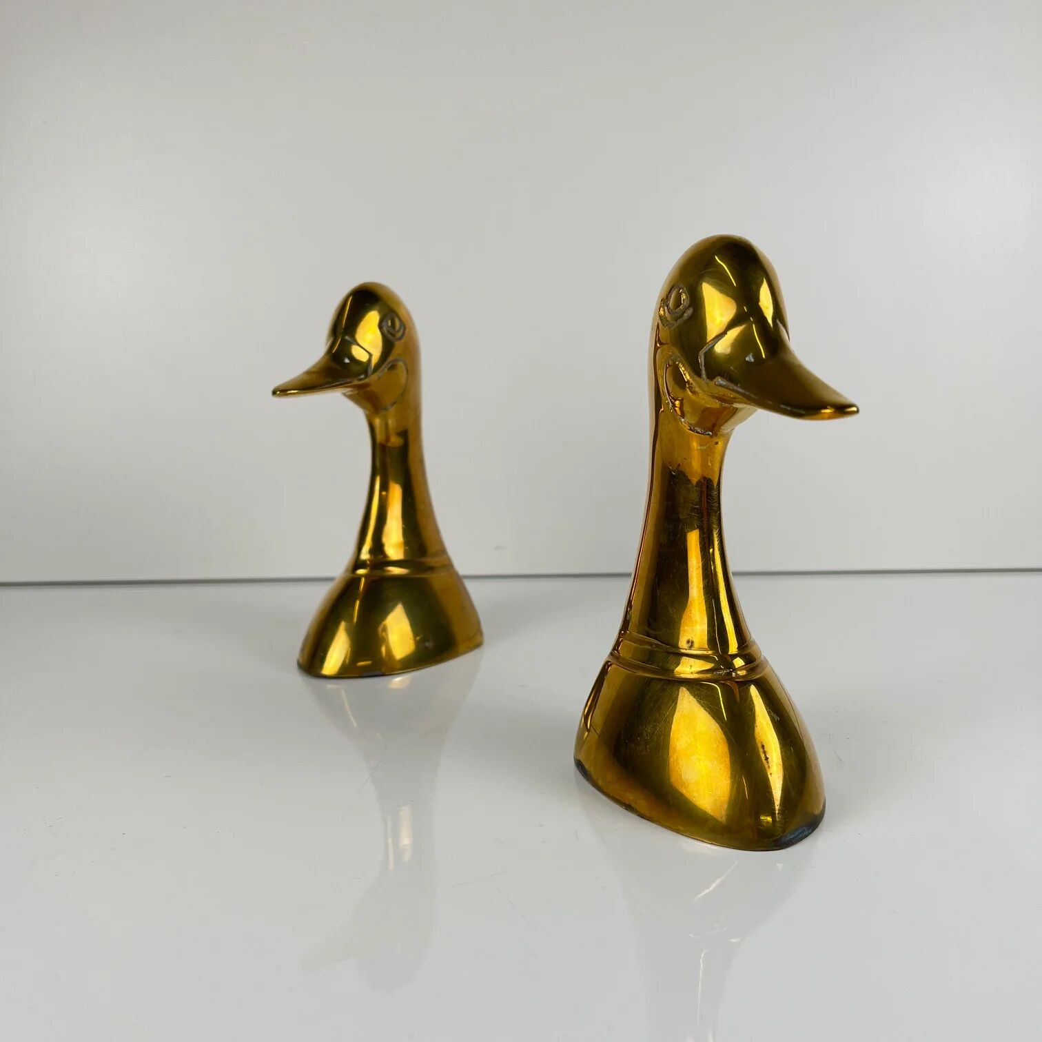 Pair of brass bookends in the shape of a duck's head, 1970.