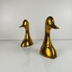 Pair of brass bookends in the shape of a duck's head, 1970.