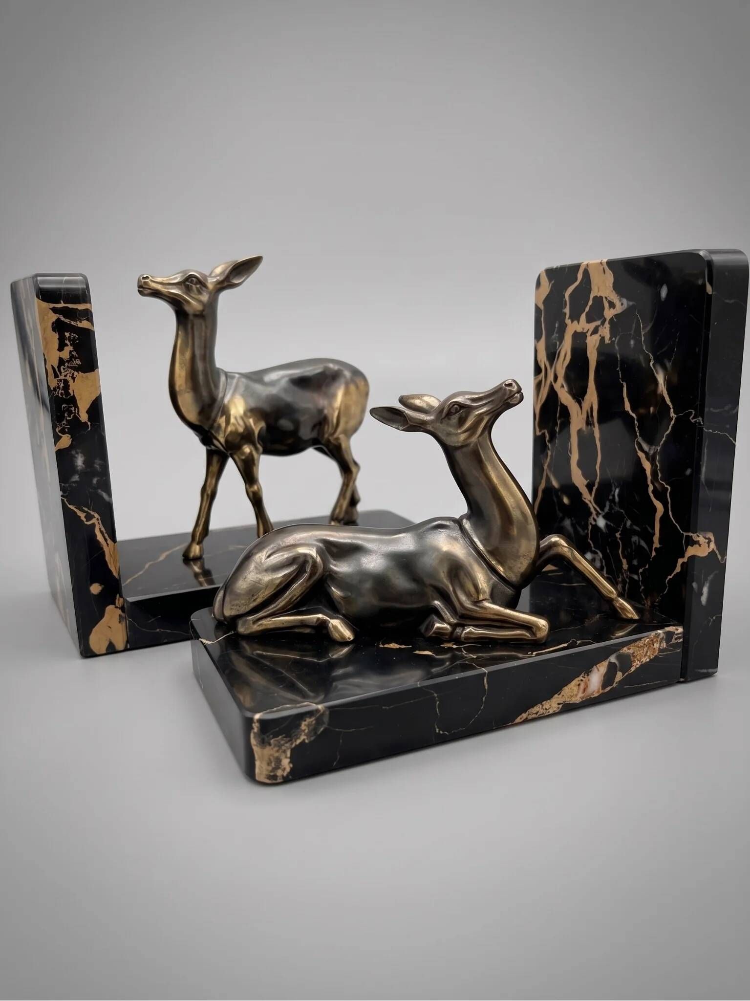 Pair of deer bookends in black marble and gold metal – Art Deco style