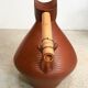 Studio pottery jug floor vase in terracotta and bamboo handle Germany 1950s