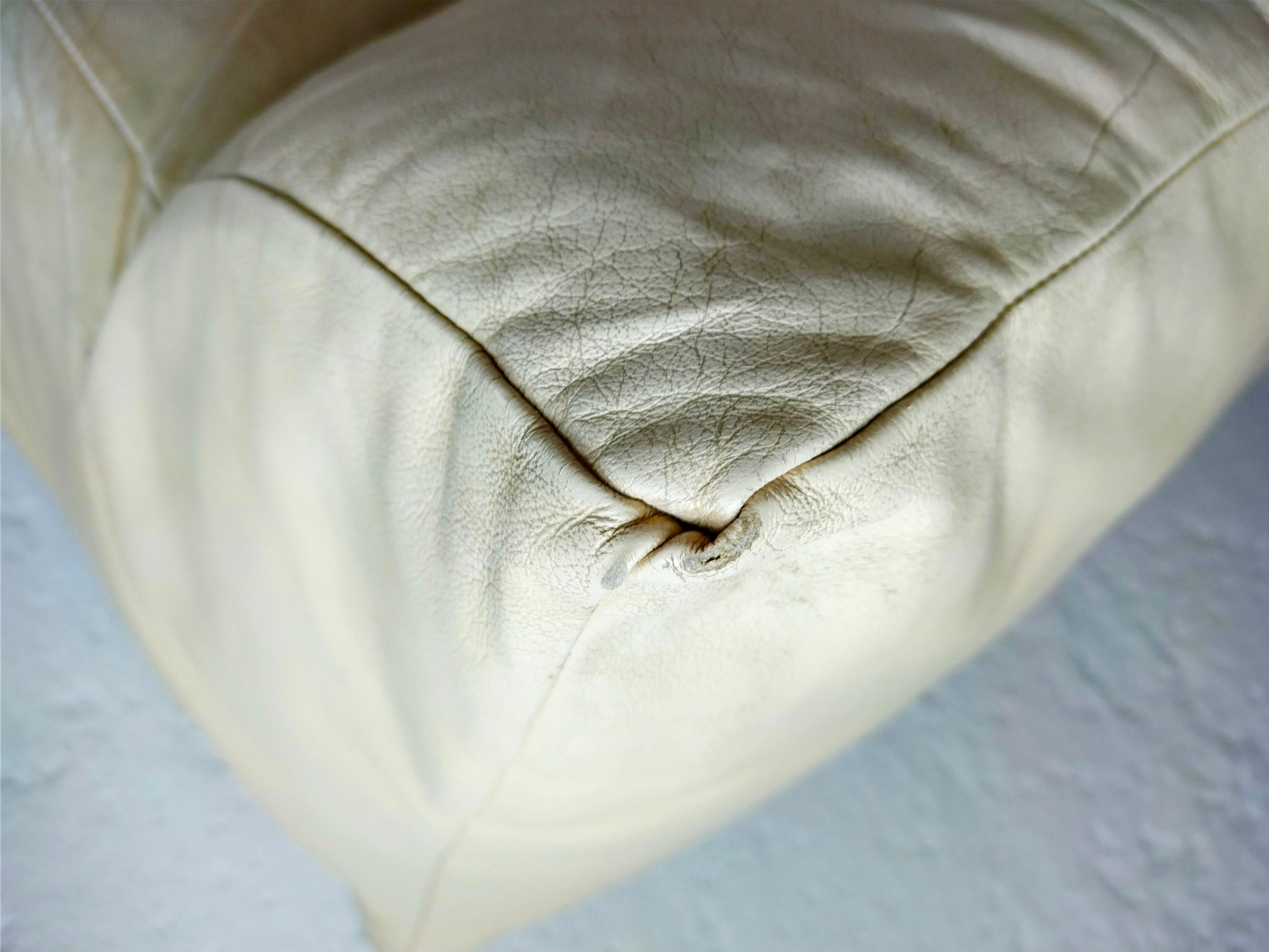 Leather armchair and cream-coloured foam, France , circa 1970