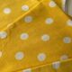 4 yellow napkins with white polka dots