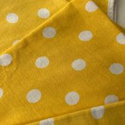 4 yellow napkins with white polka dots