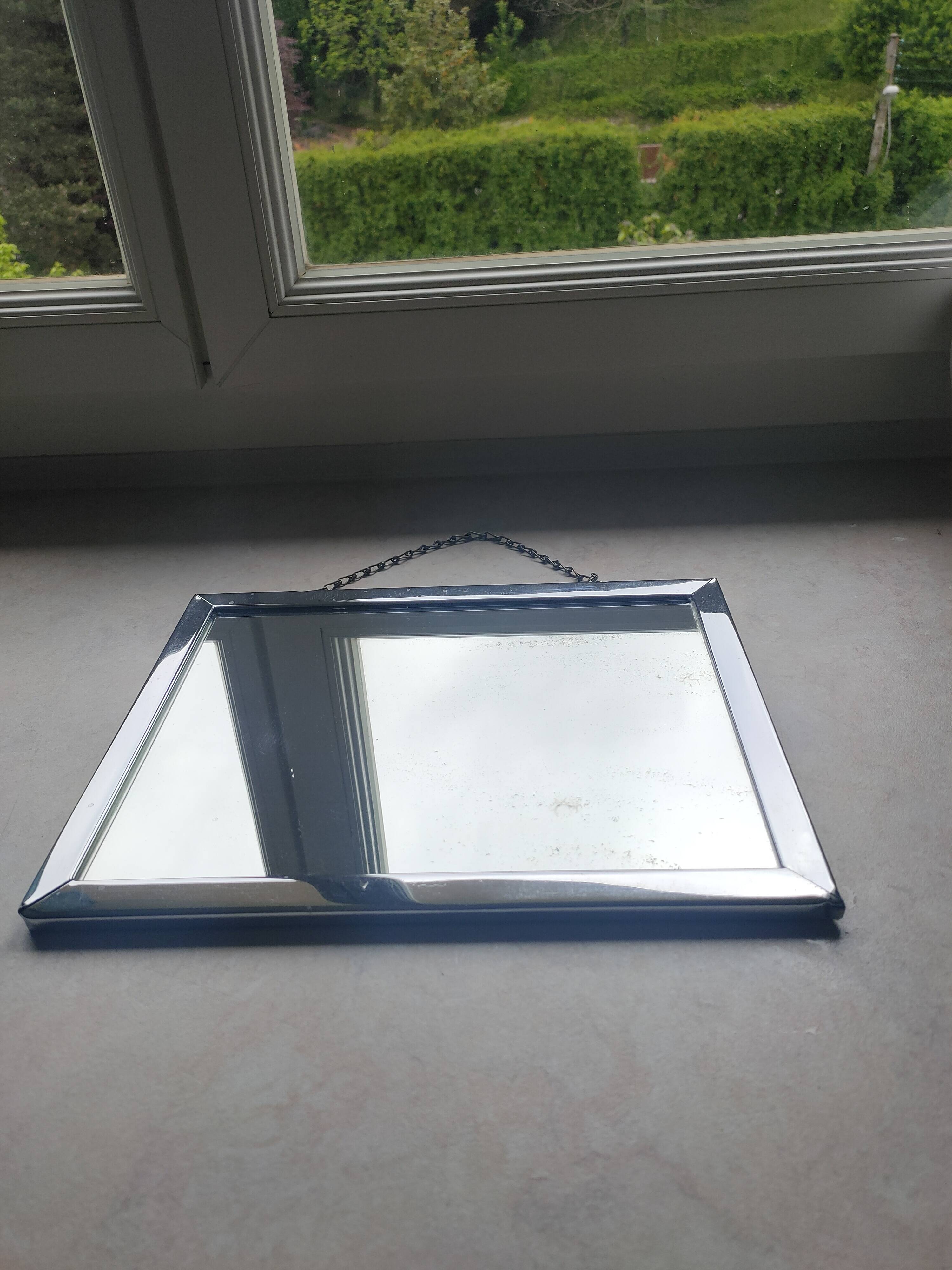 Barber mirror with chain.