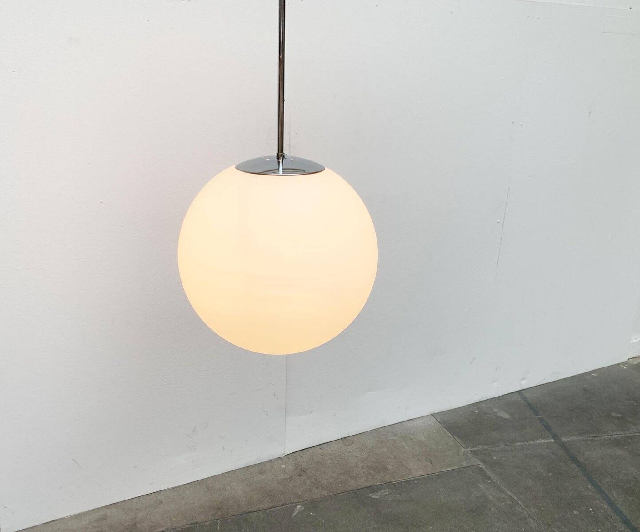 Vintage German space age glass ball pendant lamp by Limburg.
