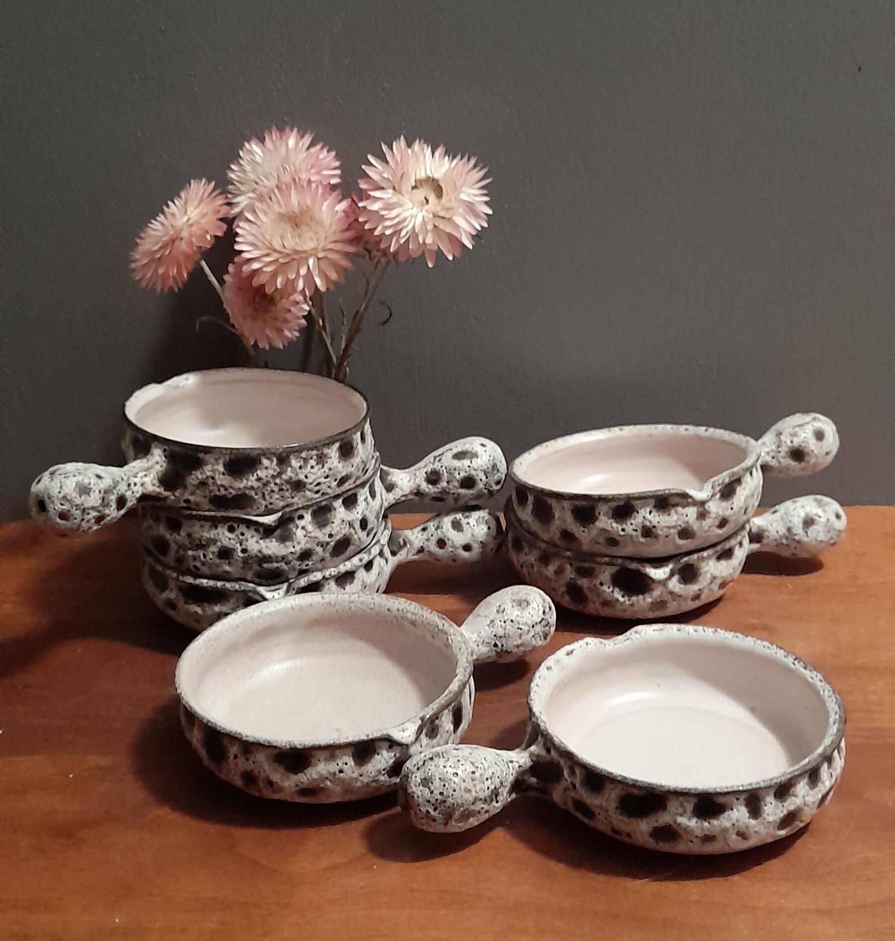 Set of 8 individual poelons/cassolettes, fat lava, stamped Vallauris