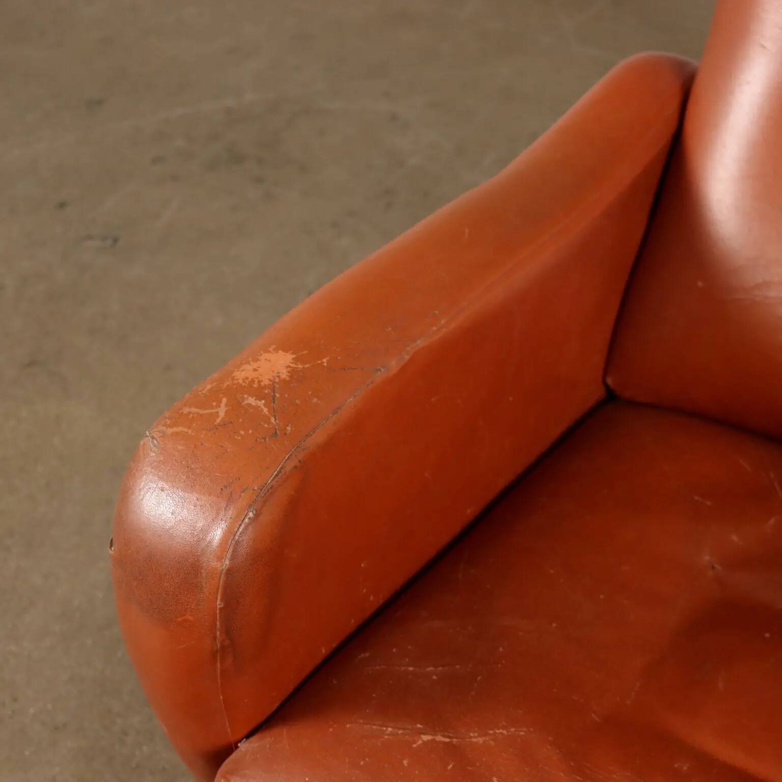 Vintage armchair from the 1970s in foam, faux leather, and metal.