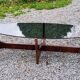Designer coffee table by Hugues Poignant in rosewood and smoked glass from the 70s