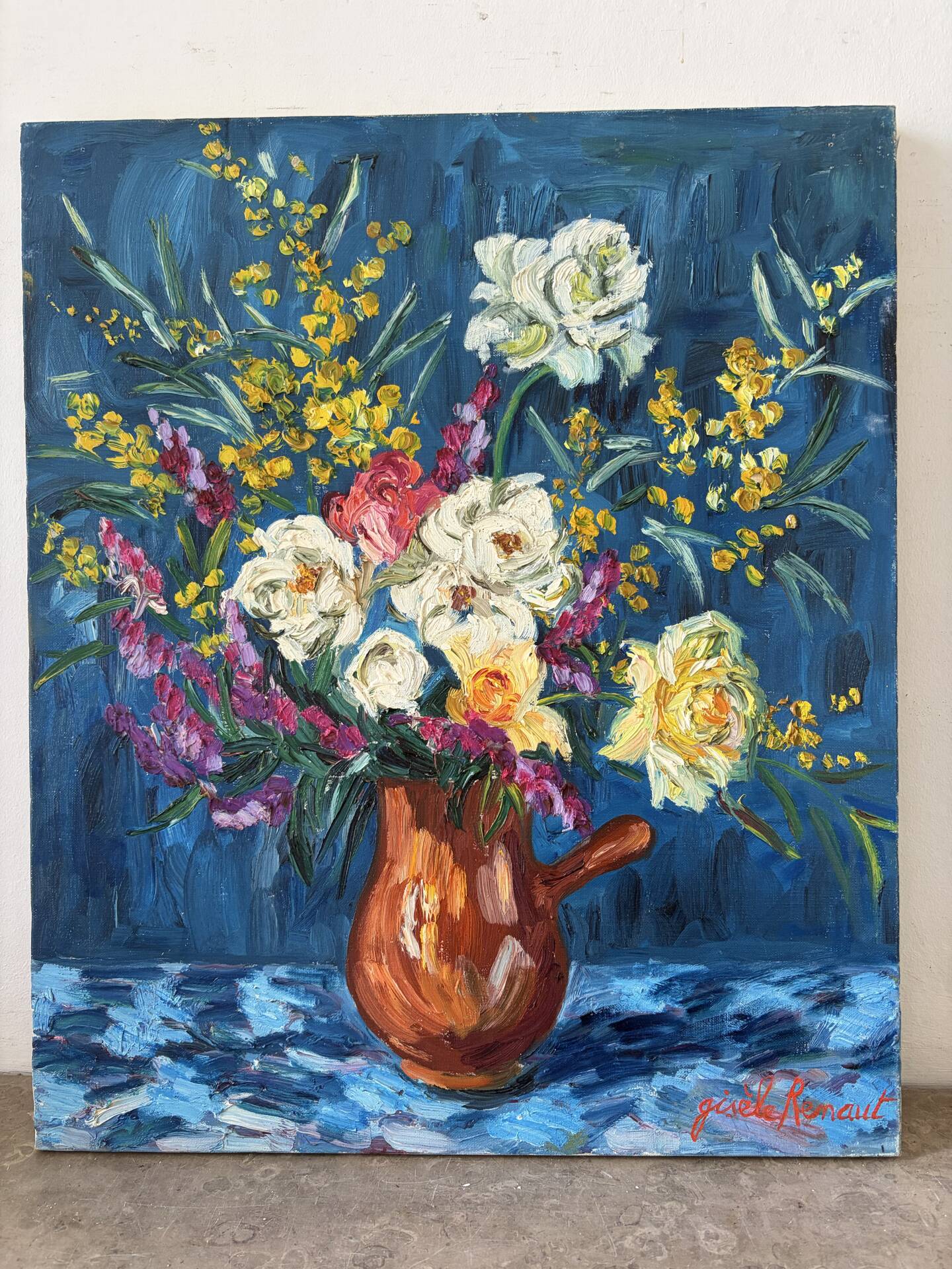 Bouquet on a blue background, oil on canvas signed Gisèle Renaut.