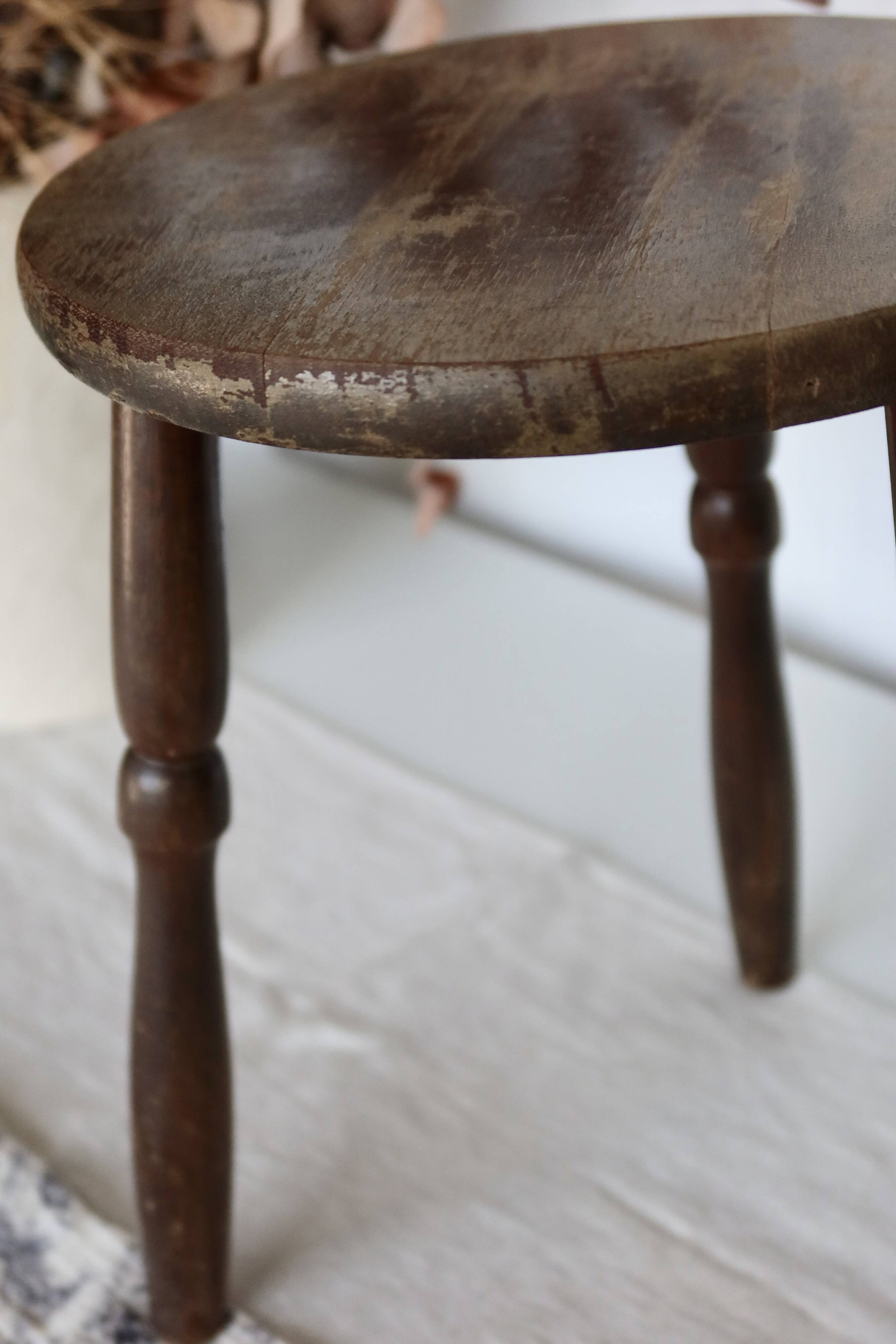 Antique tripod stool in turned wood