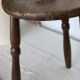 Antique tripod stool in turned wood