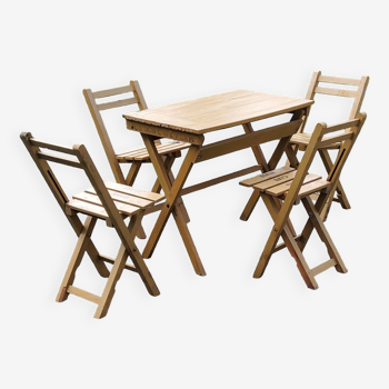 Bistro table and 4 folding slatted wooden chairs from the Grand Café de Paris