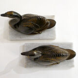 Swan bookends on marble