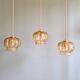 Vintage trio of amber glass pendants, 1960s-70s.
