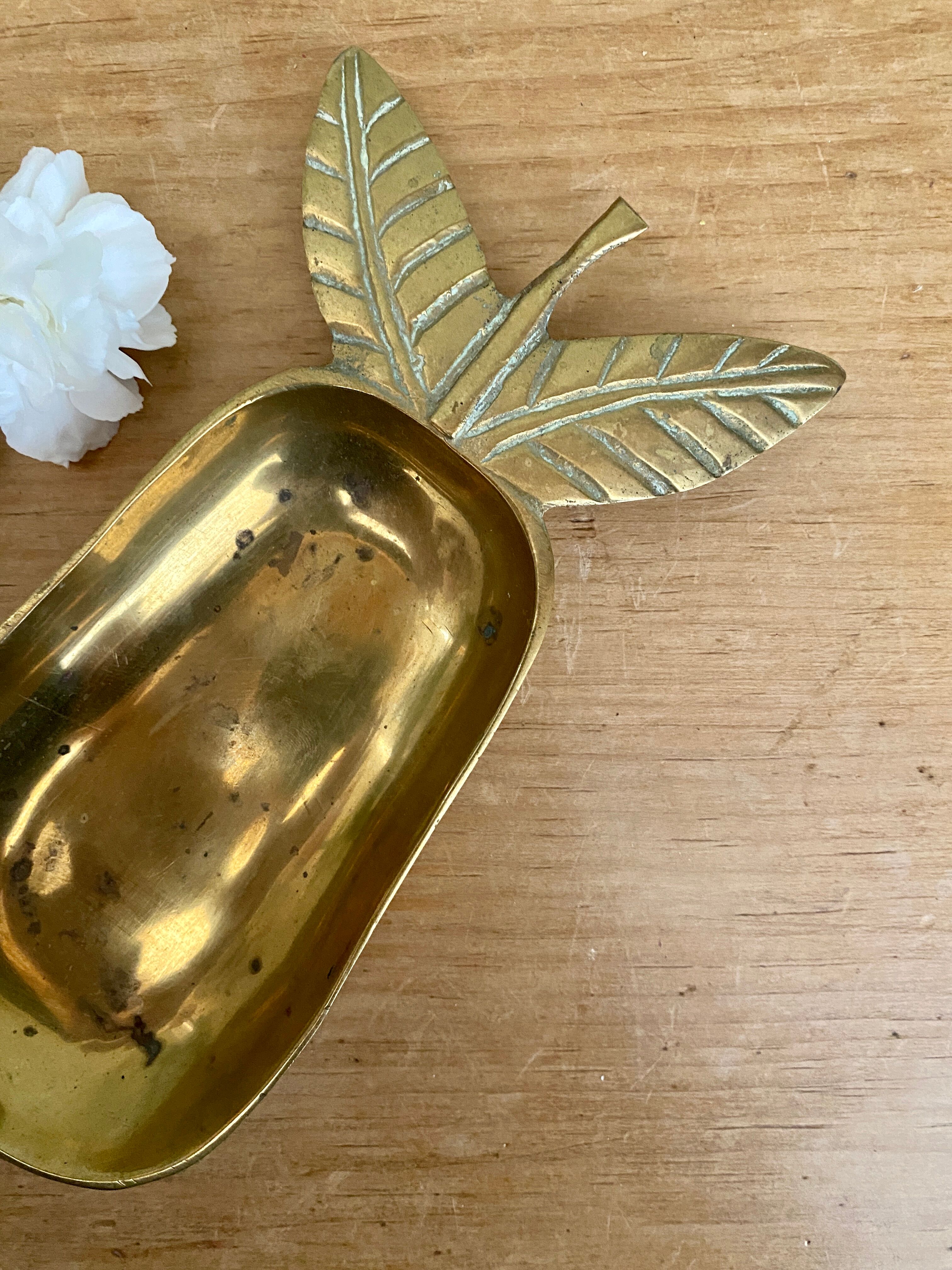 Empty vintage pear-shaped brass pocket