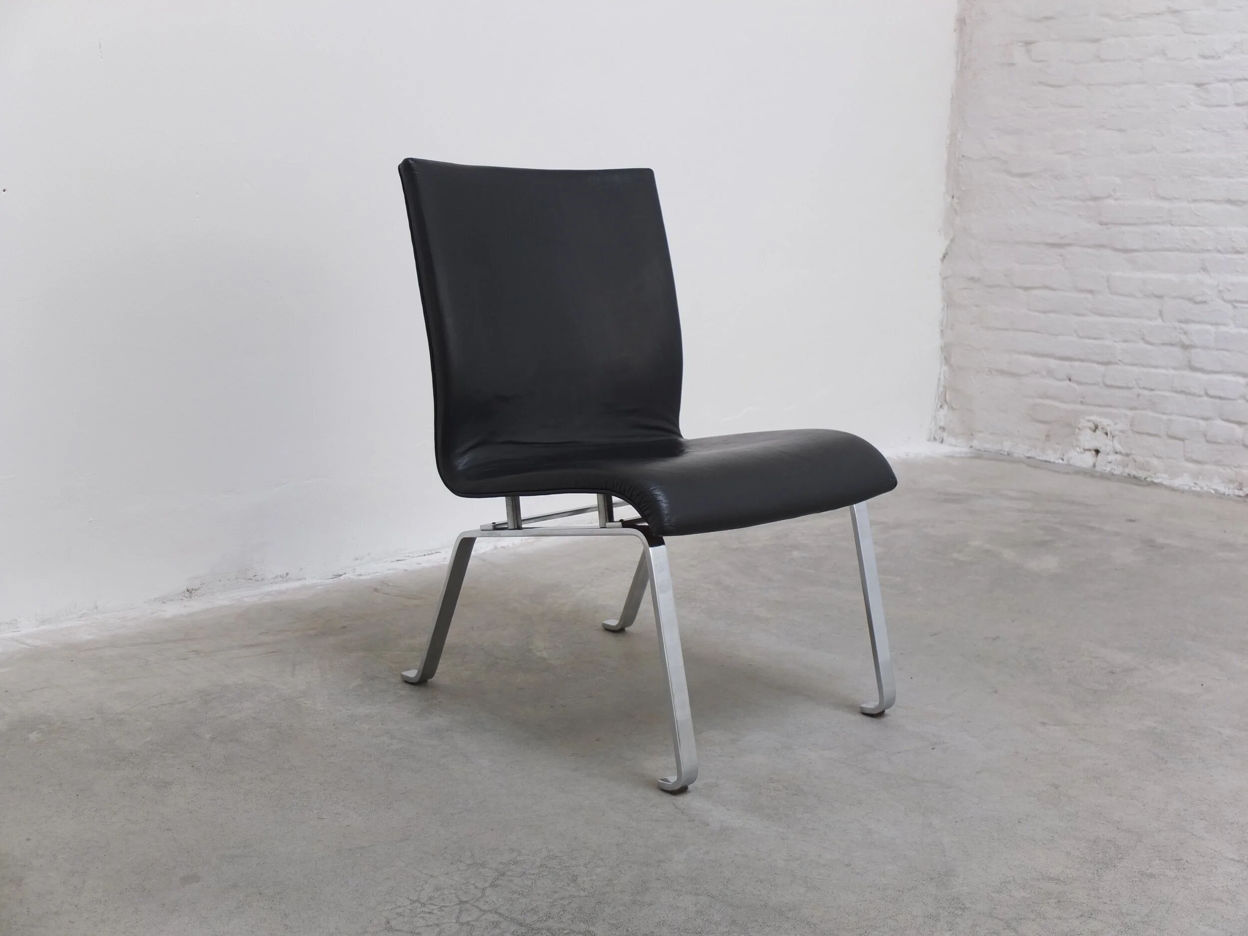 Unique black leather & steel modernist lounge chair, 1960s