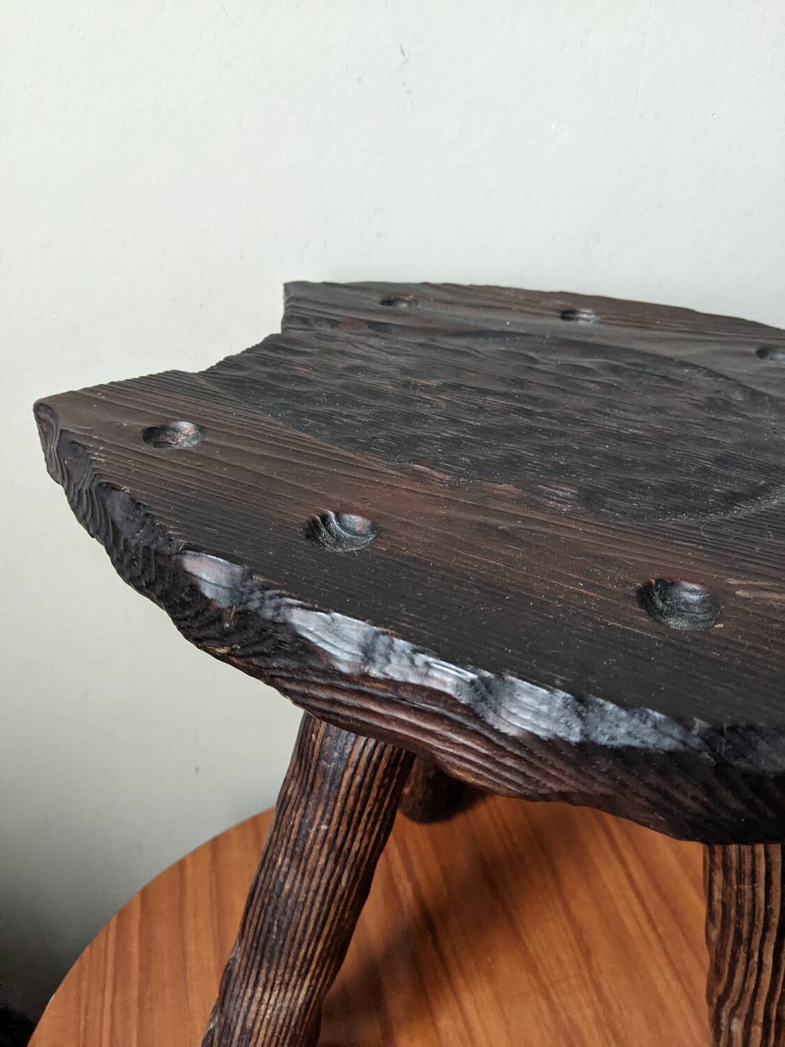 Tripod stool, horseshoe, rustic brutalist decoration.