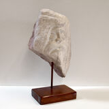 Carved stone head sculpture