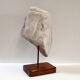 Carved stone head sculpture