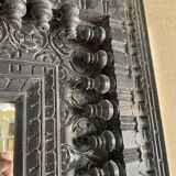 Black carved wooden mirror