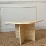 Travertine coffee table in eye shape.