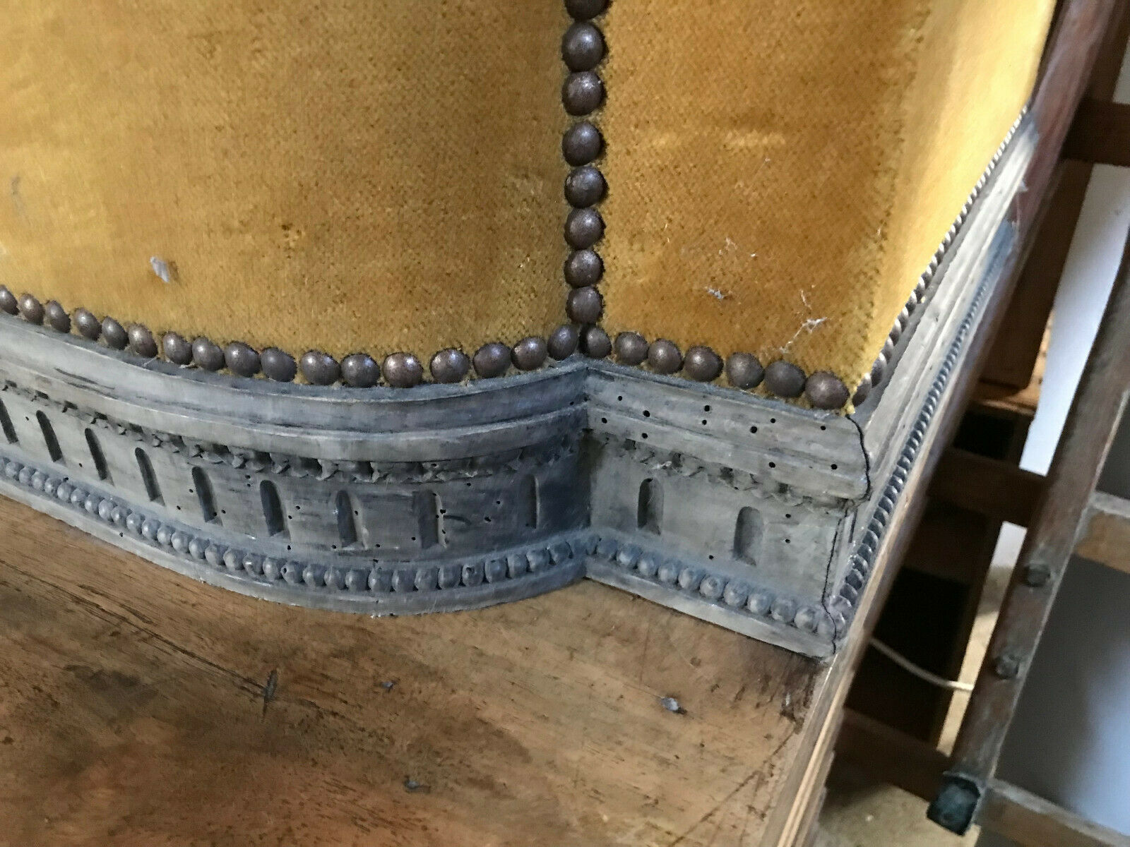 Old wooden chest and yellow velvet