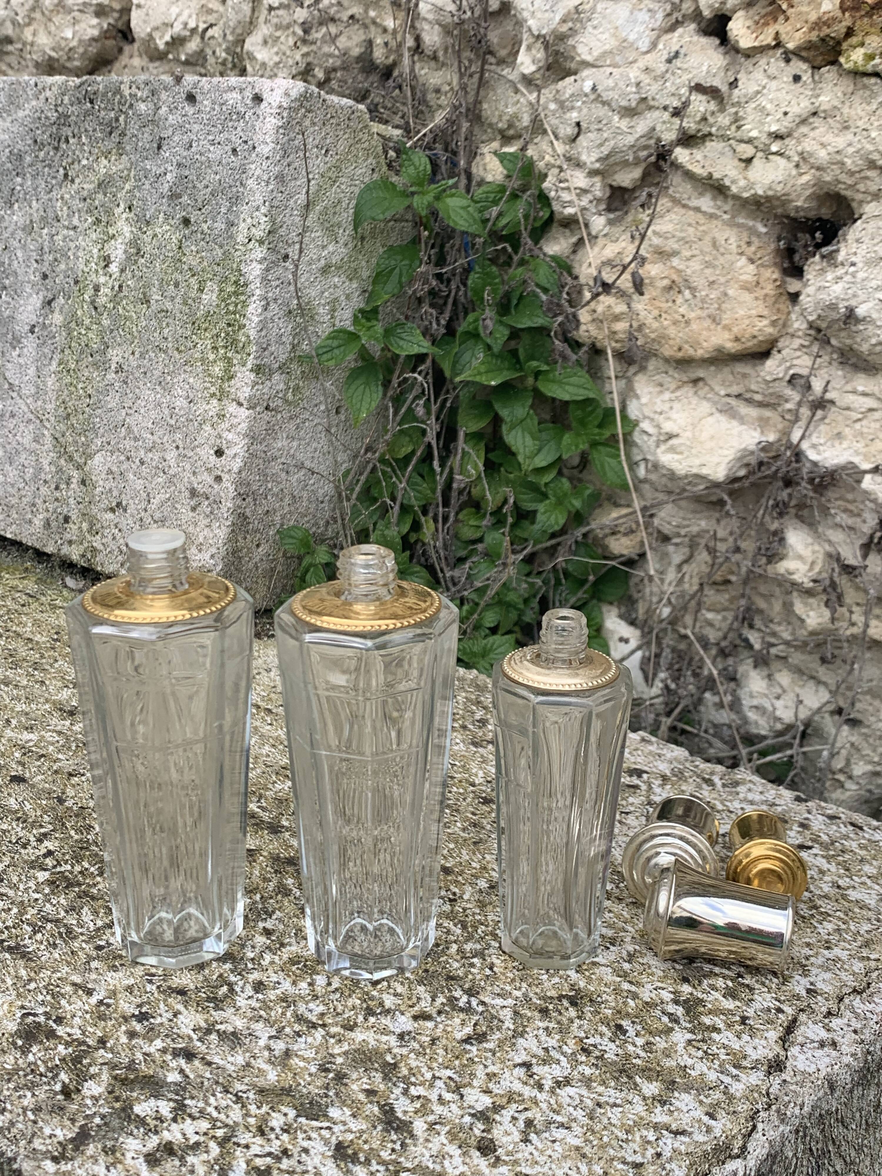 Three bottles of crystal perfume signed Marcel Rochas old france