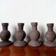 Four vintage handcrafted candle holders
