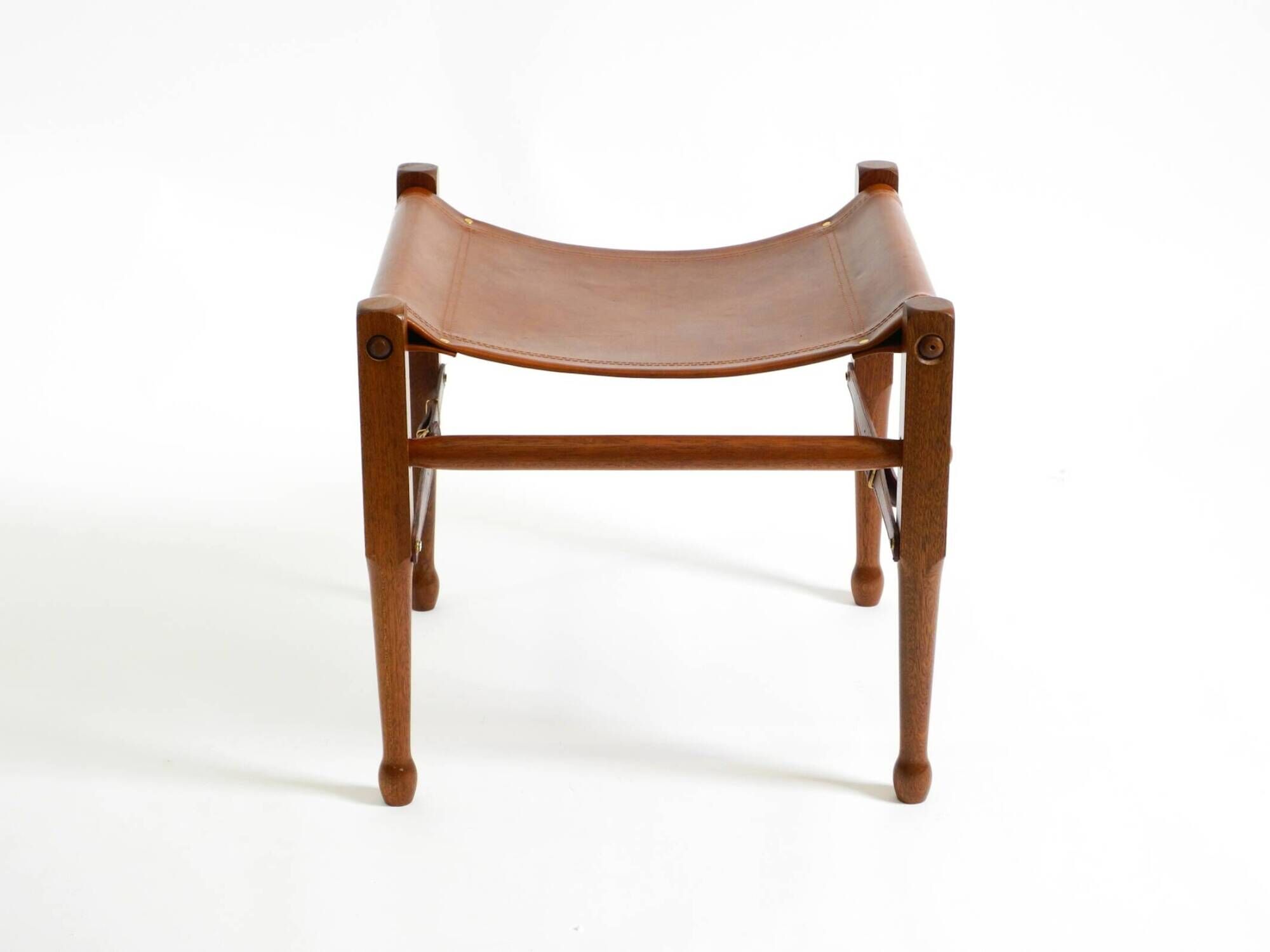 Rare 1990s safari stool with a teak frame and a seat made of brown saddle l