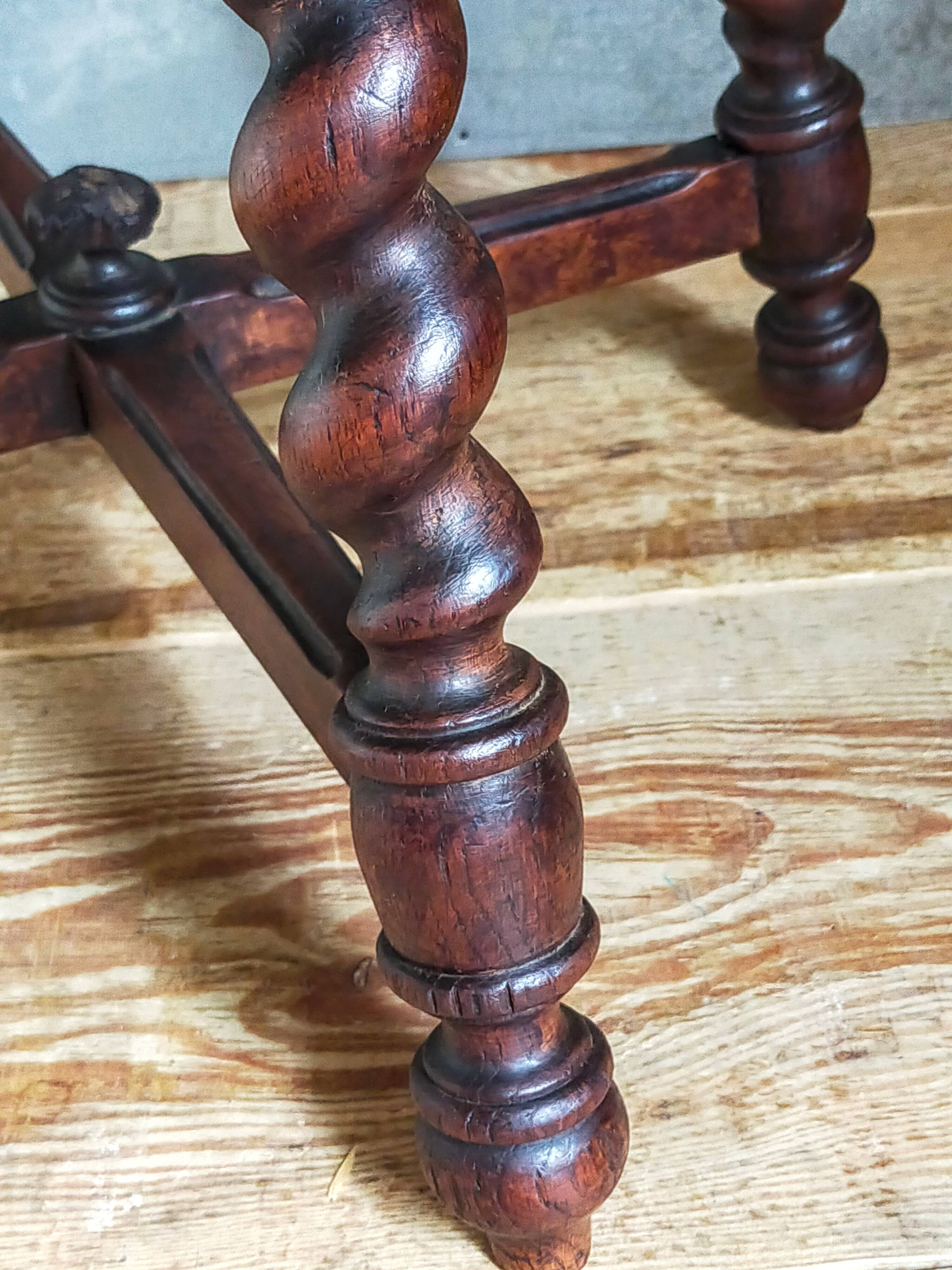 Antique stool in turned and carved solid wood
