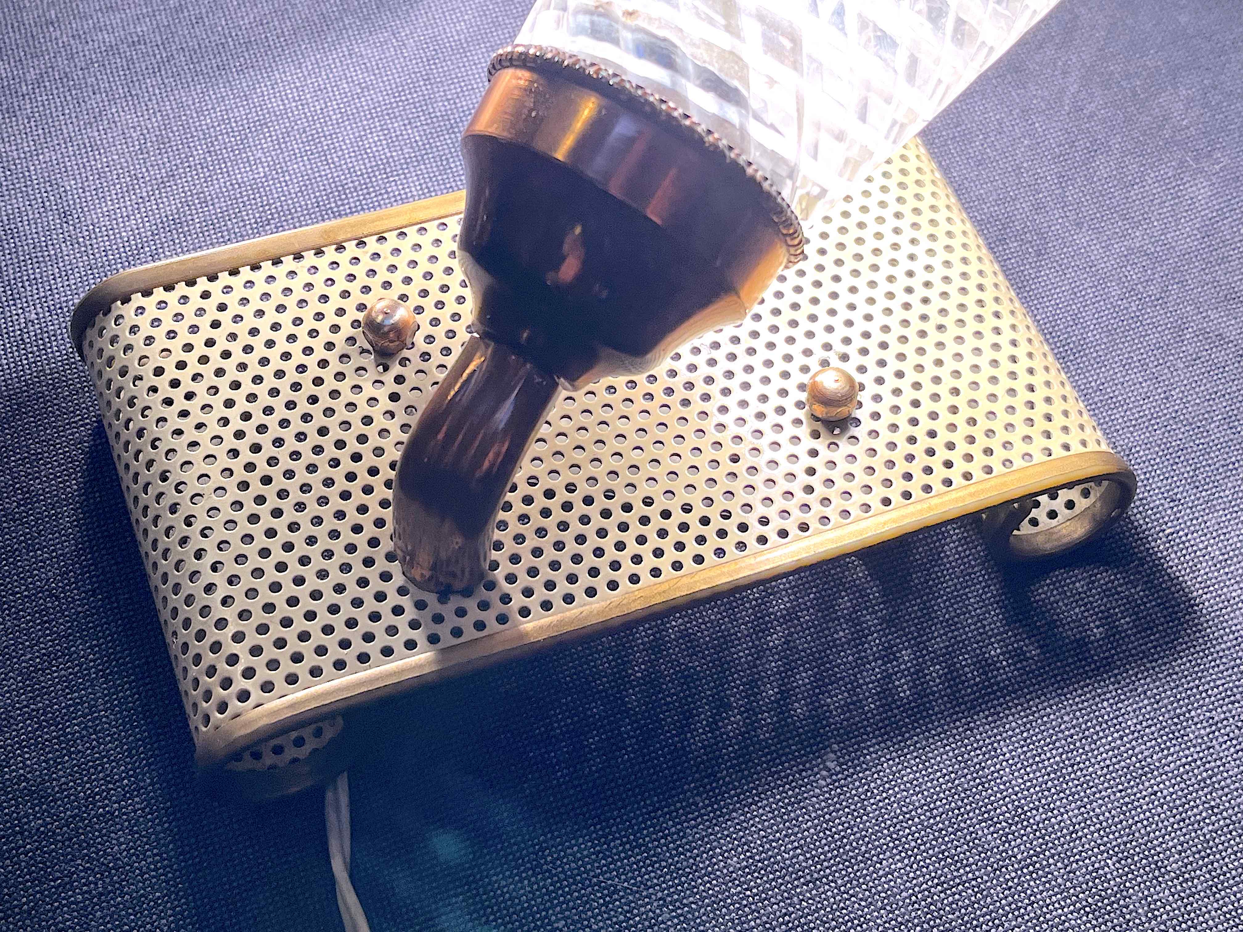 Pair of brass sconces, perforated metal and perhapx conical lampshade, France 50's