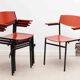 Gijs van der Sluis red and black chairs with armrests