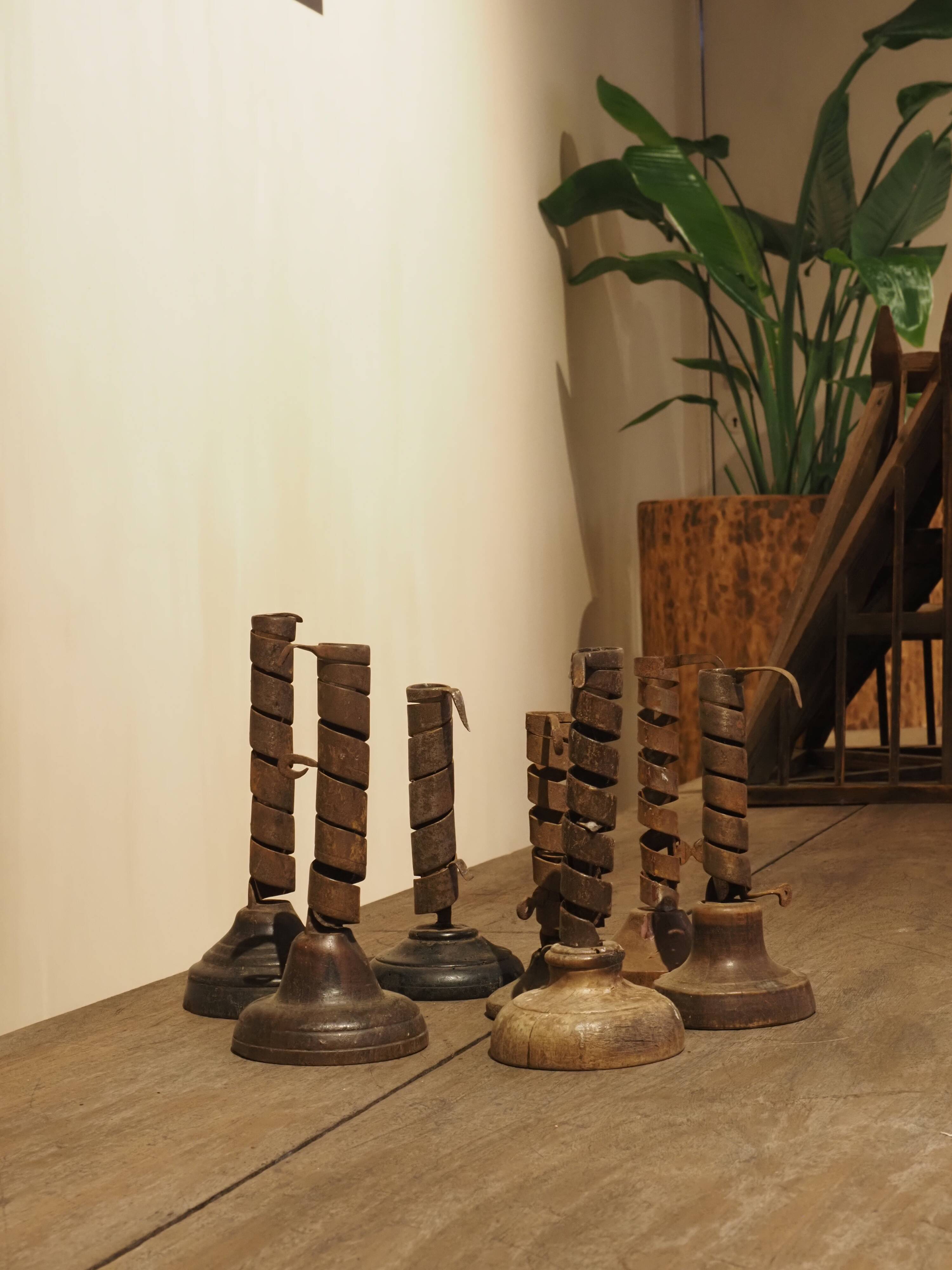 19th-century wrought iron "Rat de Cave" candlesticks from Normandy, set of 7.