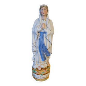 Religious statuette of the Virgin Mary in bisque porcelain