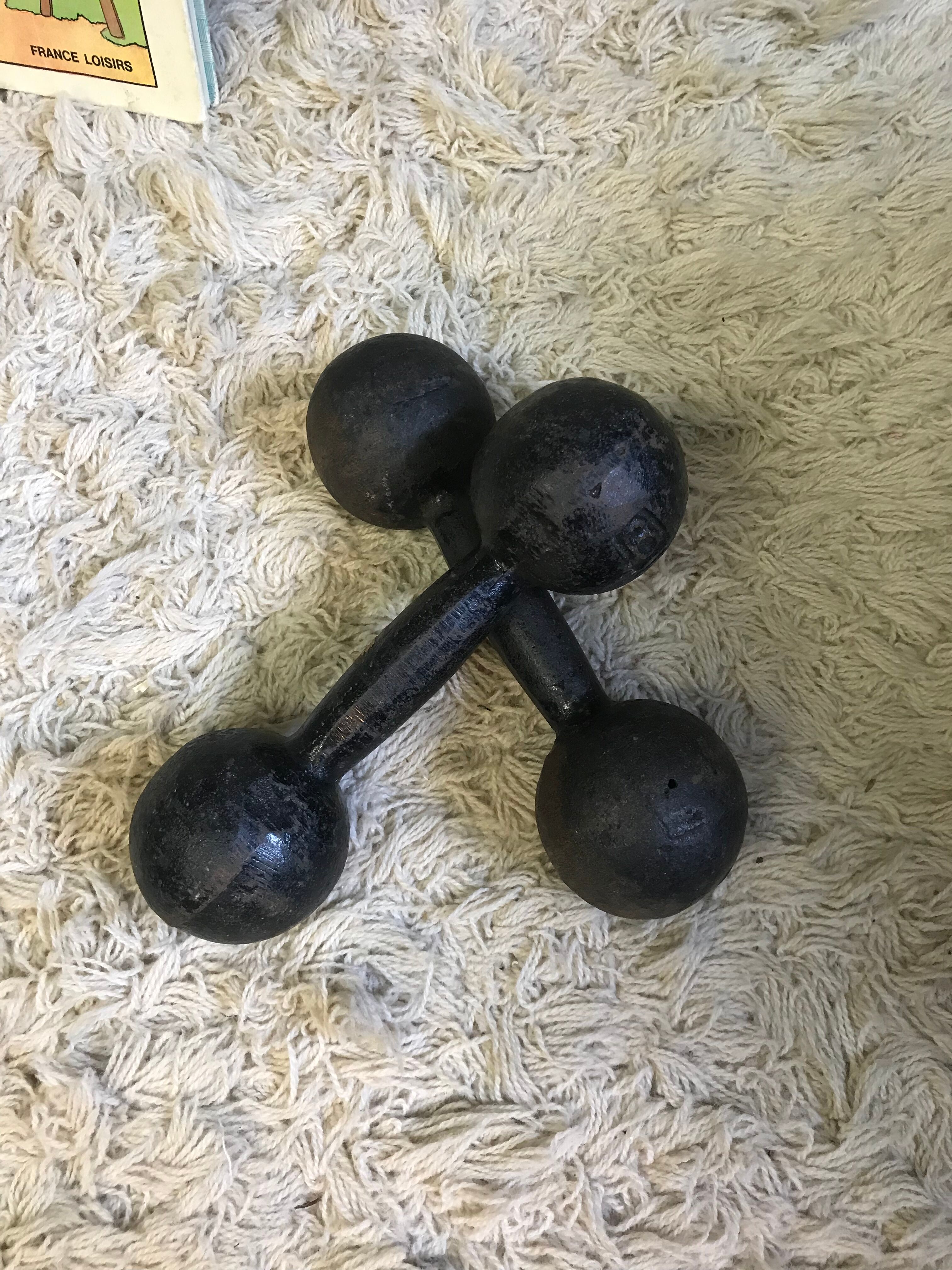 Pair of old cast iron dumbbells
