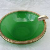 Green glass ashtray set in gold brass