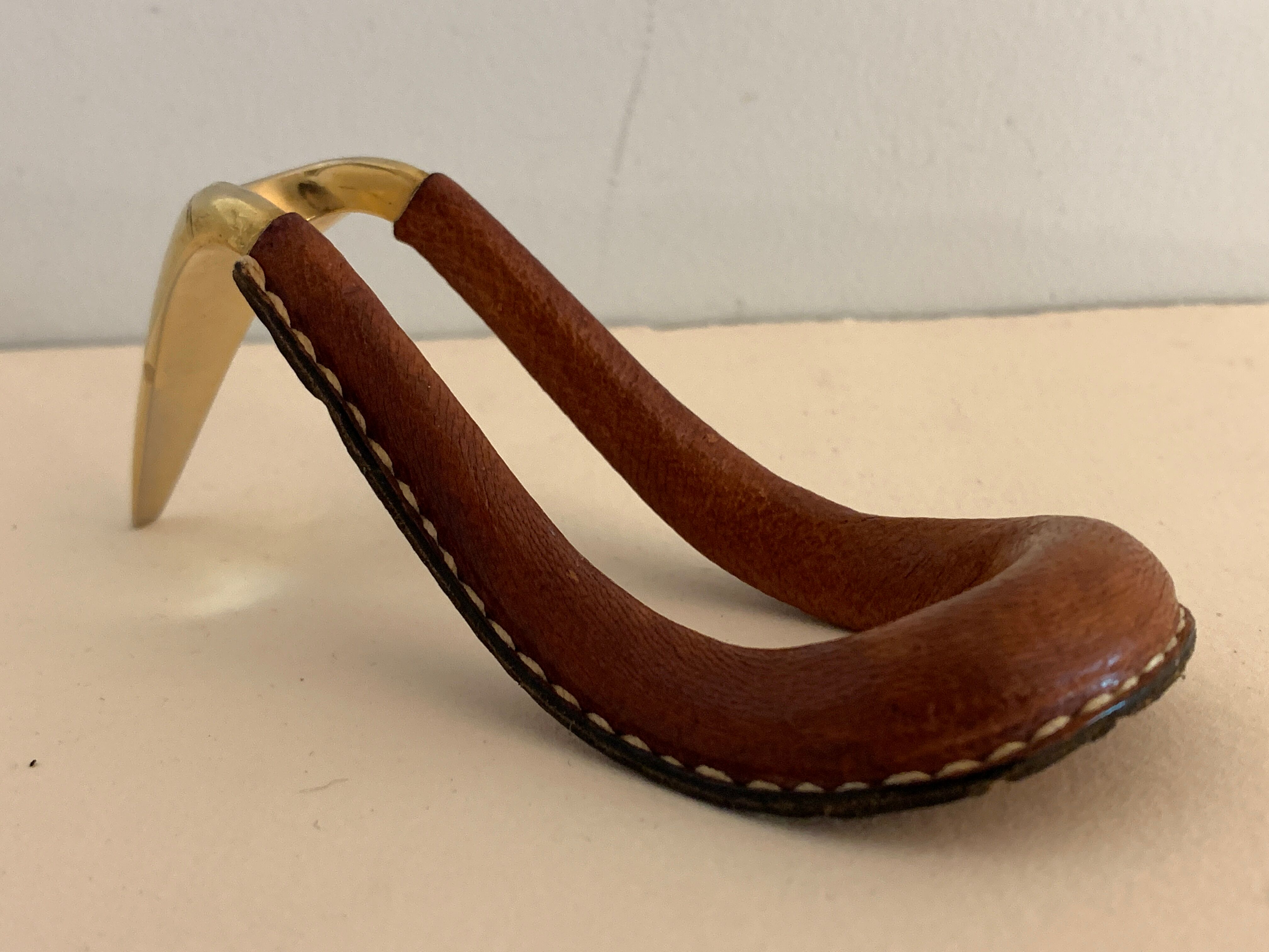 Carl Auböck pipe rack in leather and bronze, 1963