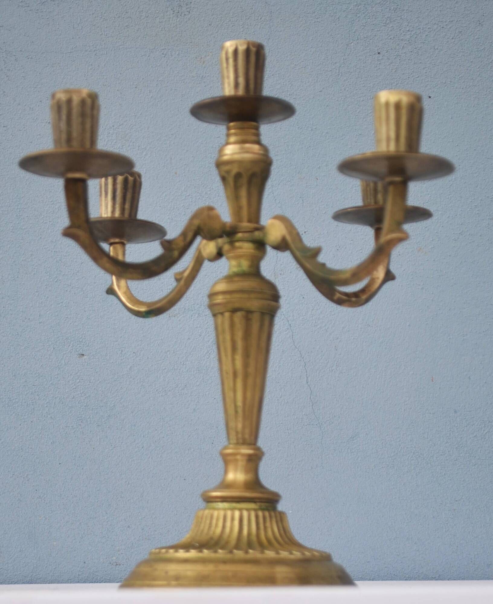 Solid brass candle holder with 5 candles and 4 arms