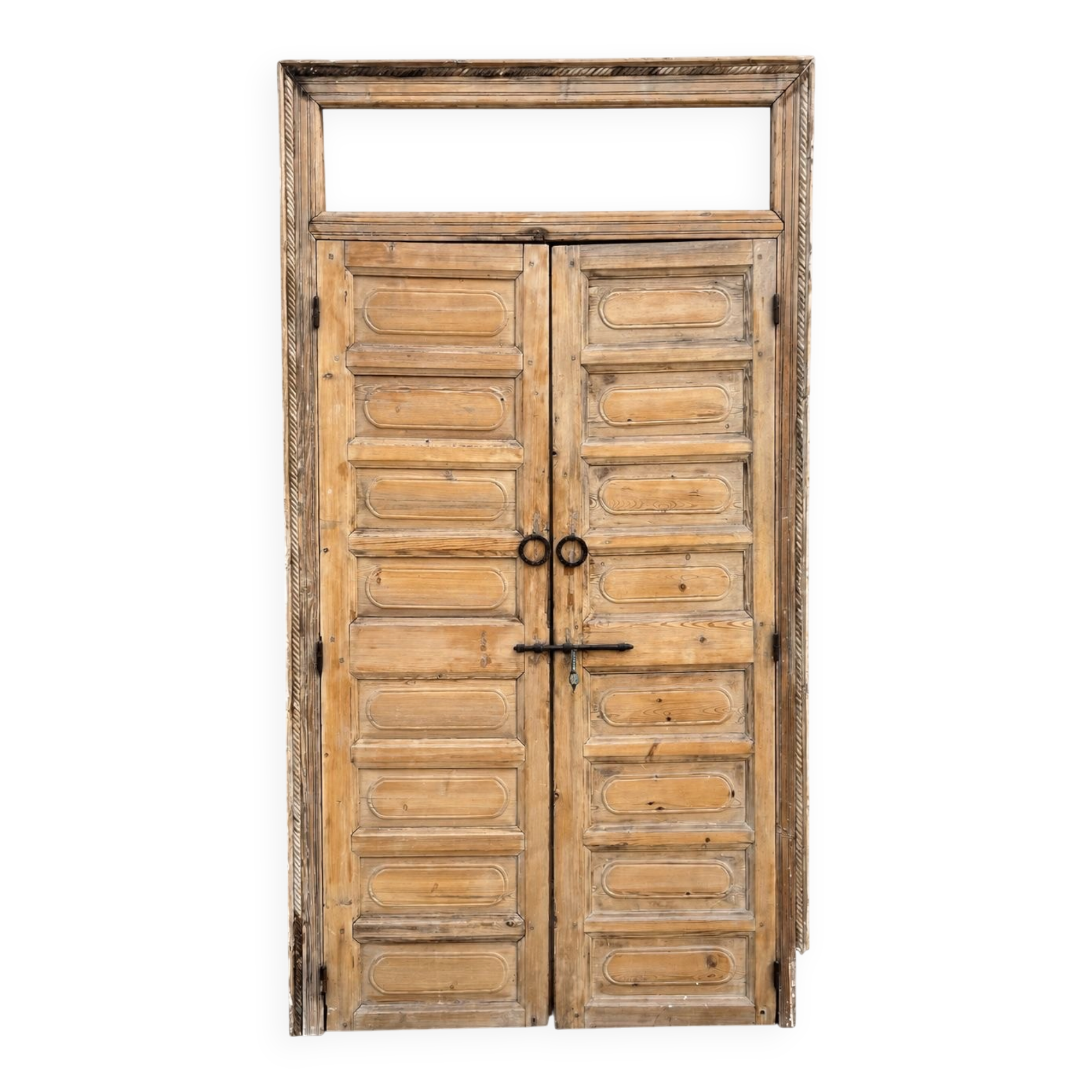 pair of old double-leaf doors with transom and carved frames