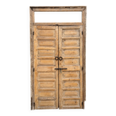 pair of old double-leaf doors with transom and carved frames