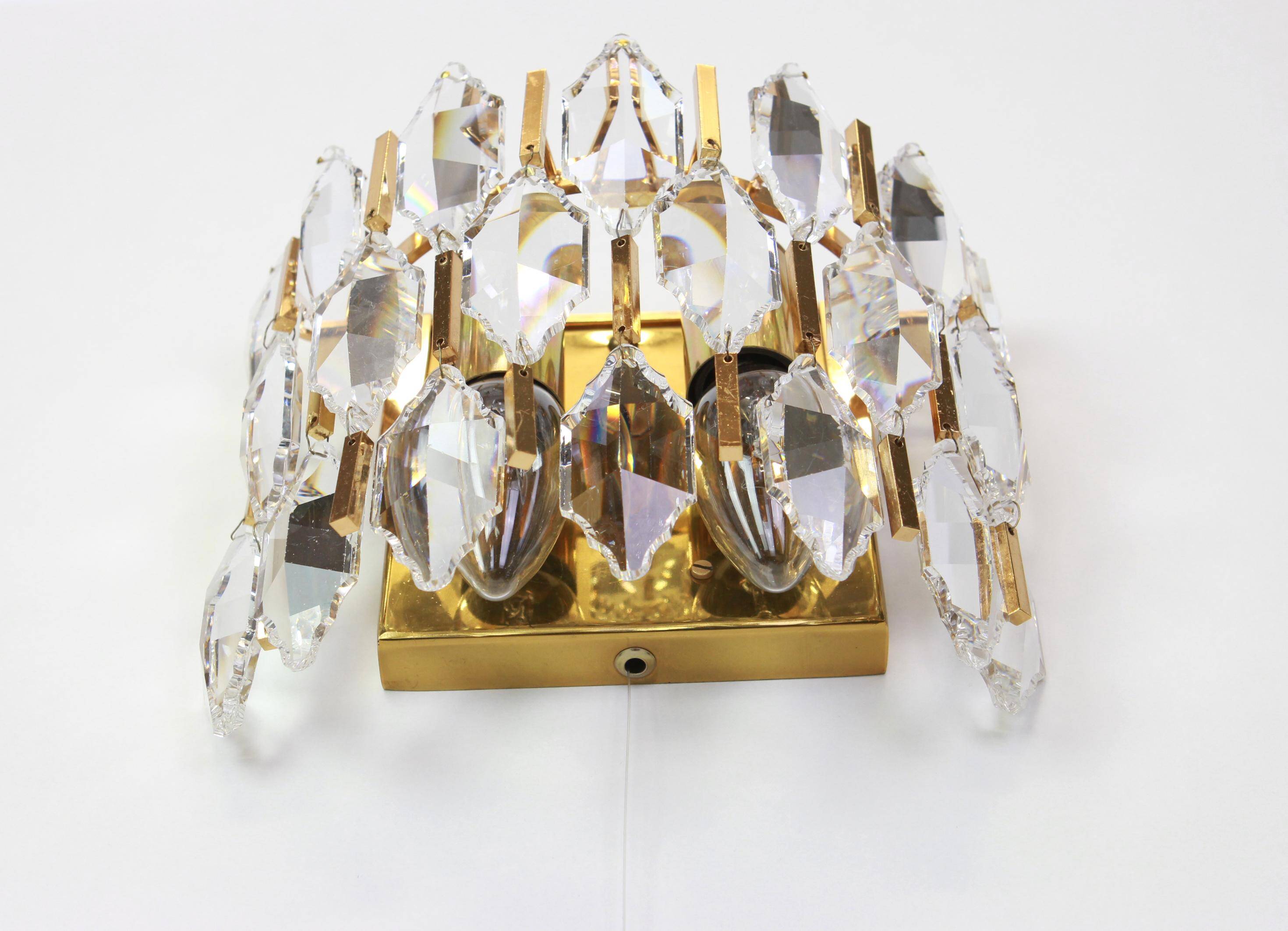 Pair of wall sconces in gilded brass and crystal by Palwa, Germany, 1970s.