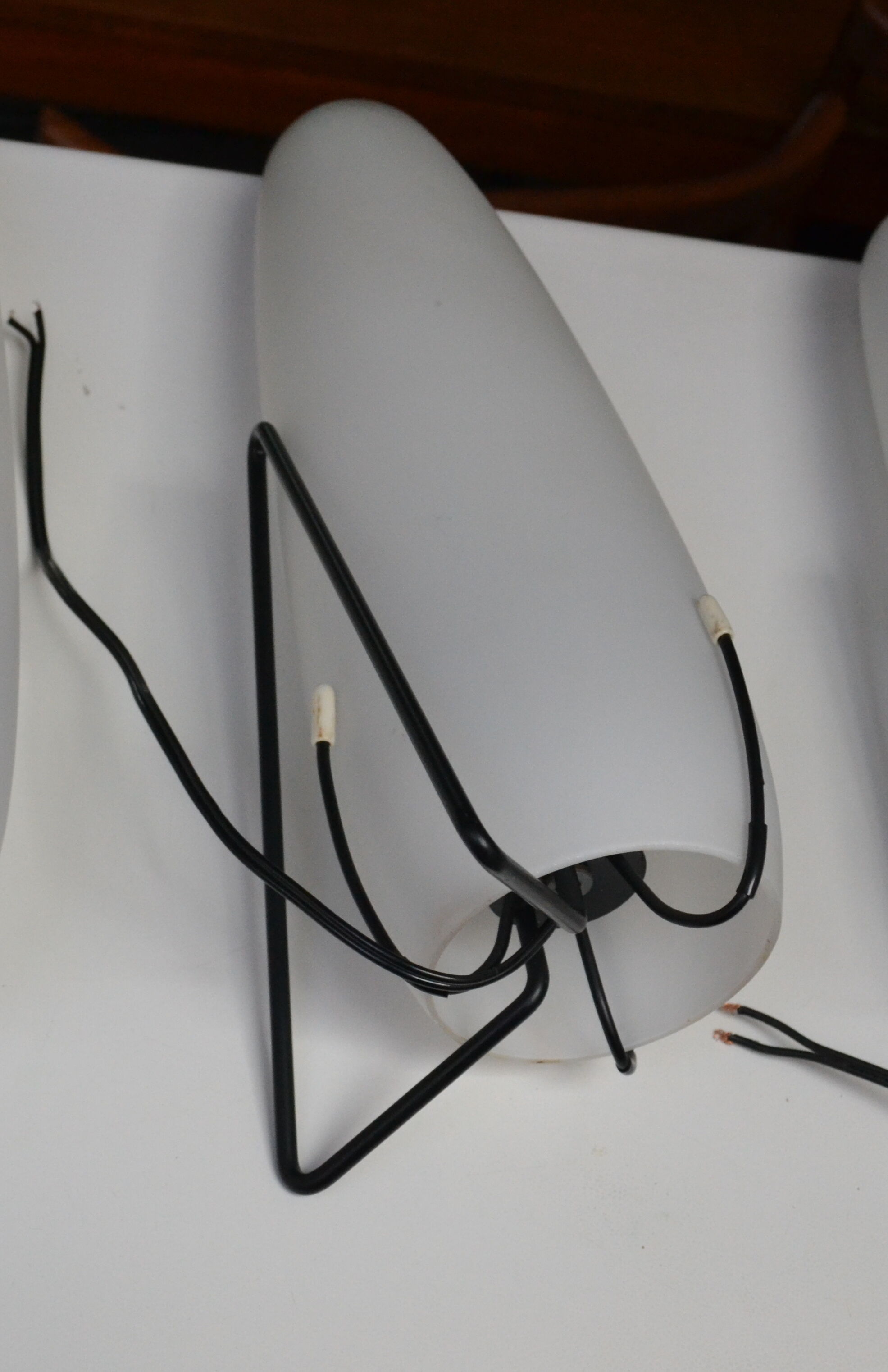Louis Kalff opaline and metal wall light from the 1950s.