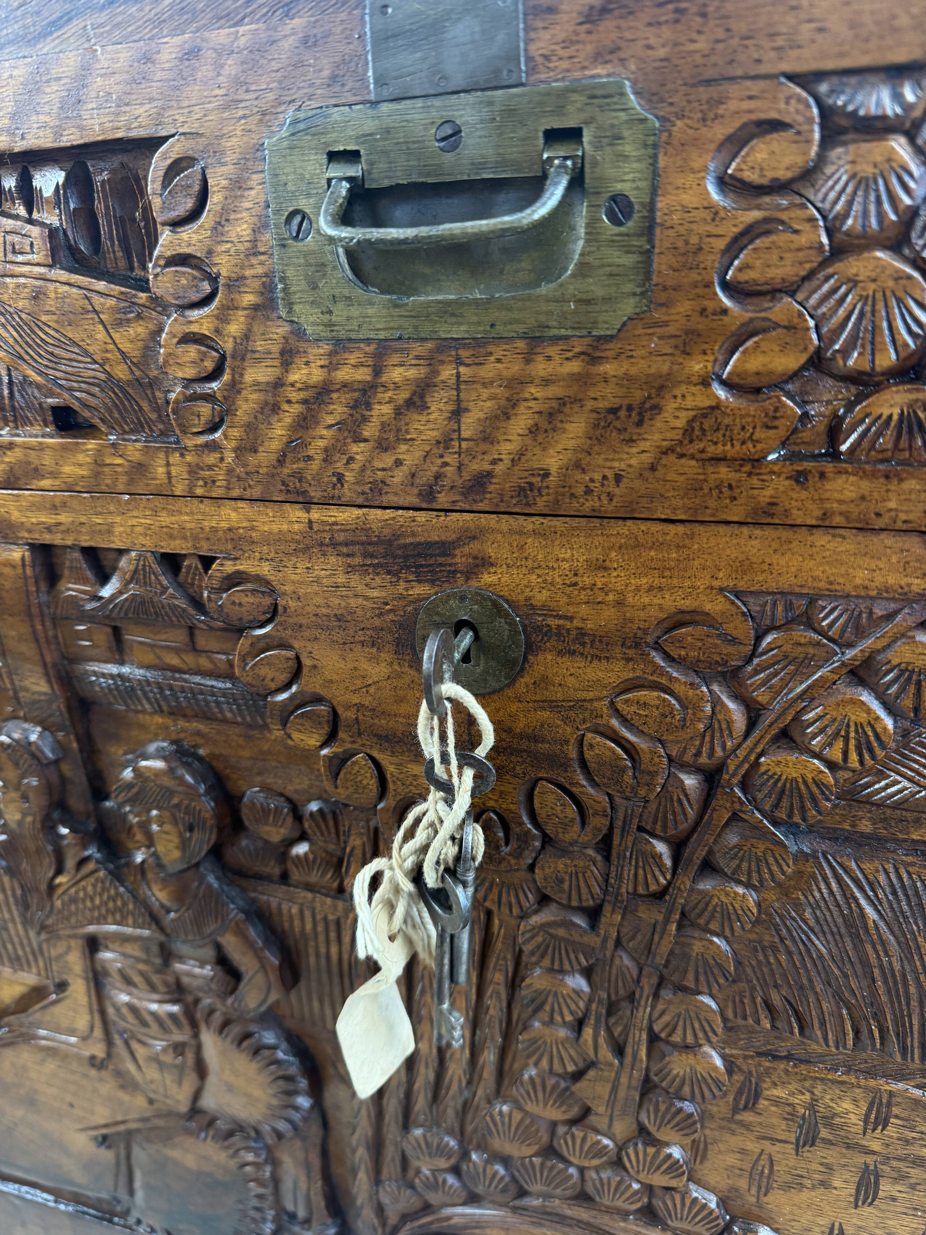 Chinese carved chest made of solid wood — life scenes in bas-relief