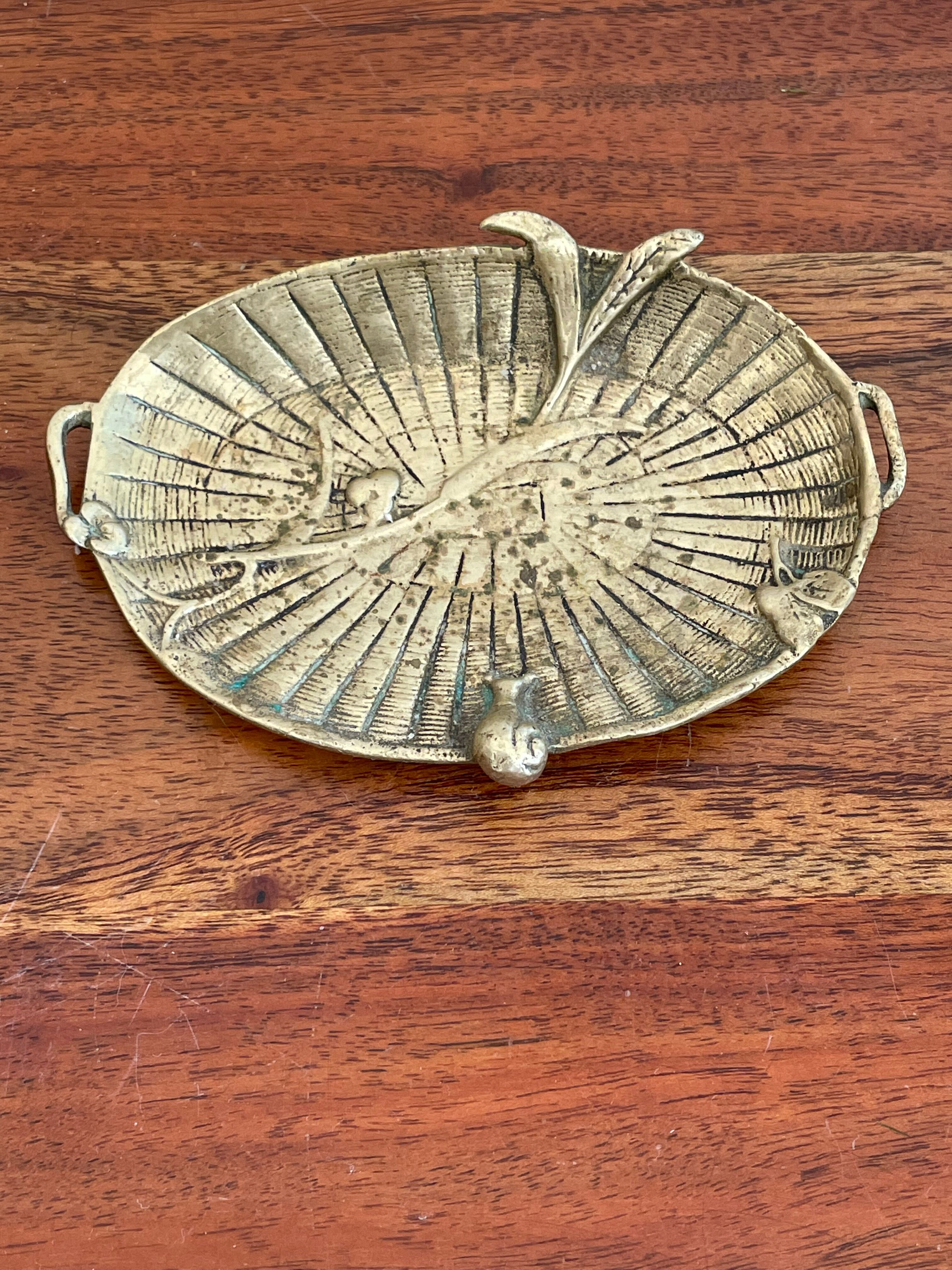 Empty brass snail pocket