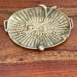 Empty brass snail pocket