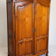 Linen cupboard in cherry wood in Louis XV style with two doors.